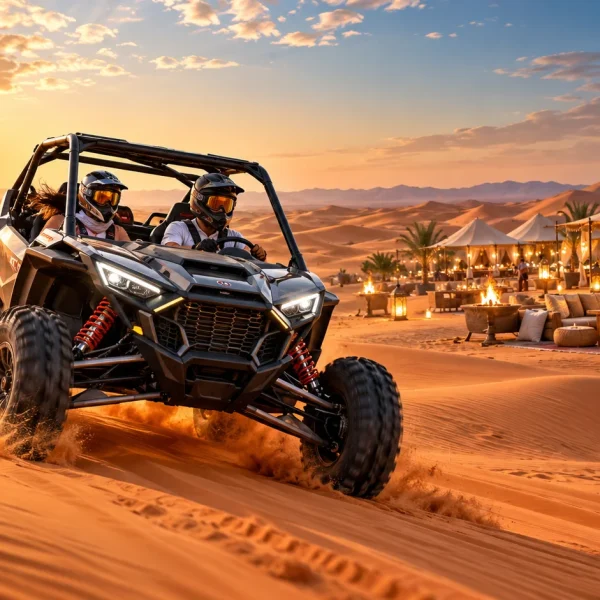 Polaris dune buggy driving across Dubai desert dunes with desert camp dinner setting in the background